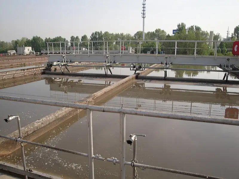 Settling tank used in primary treatment of wastewater, where solids are allowed to settle at the bottom for separation from the wastewater.